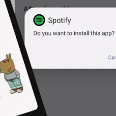 Ekran telefonu z logo Spotify, komunikatem o instalacji aplikacji i fragmentami stron internetowych.